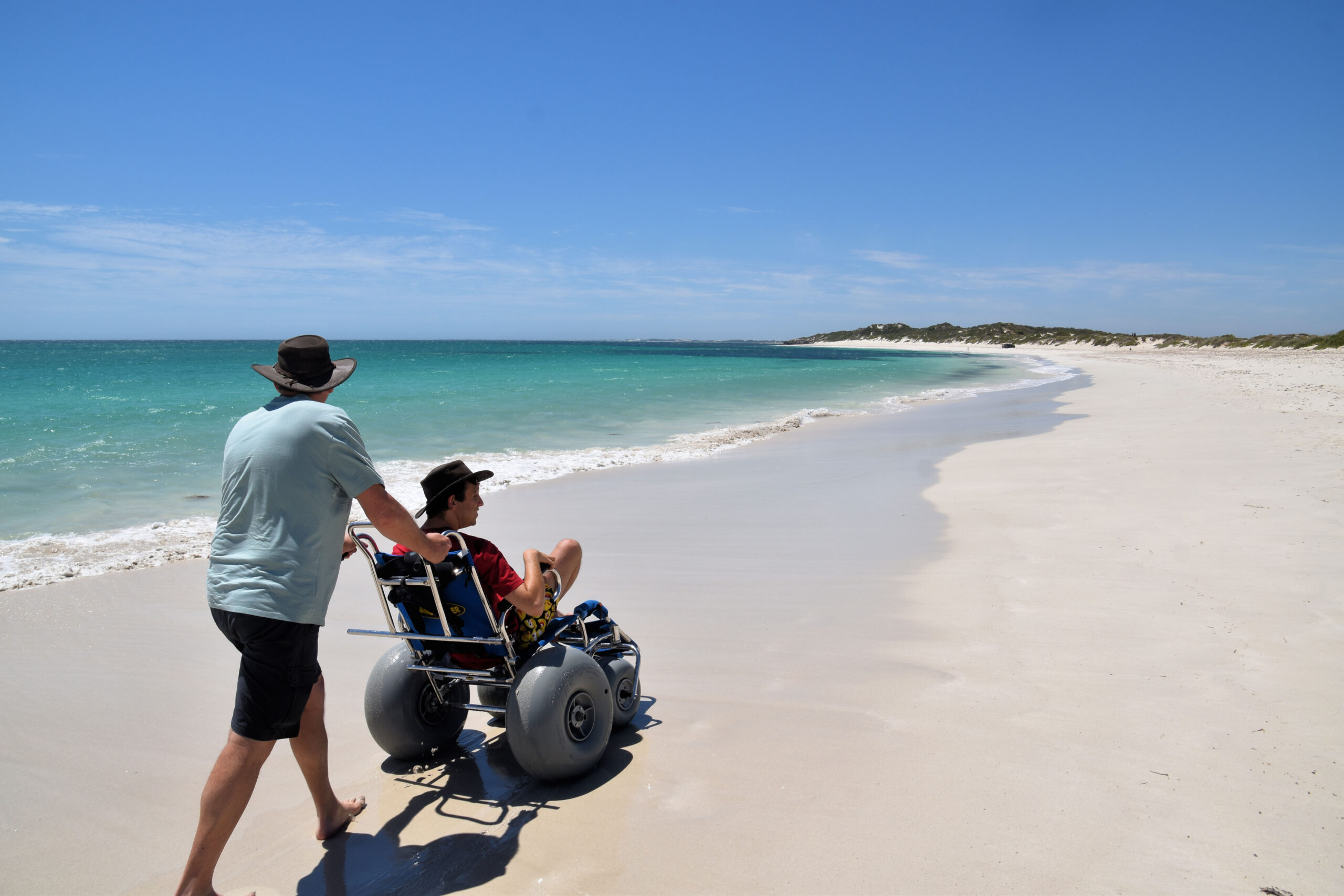 Wheelchair user along the beach.