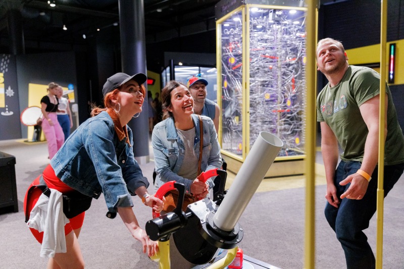 Visitors explore hands-on exhibits across the open levels of Questacon, the national science and technology centre in Canberra.