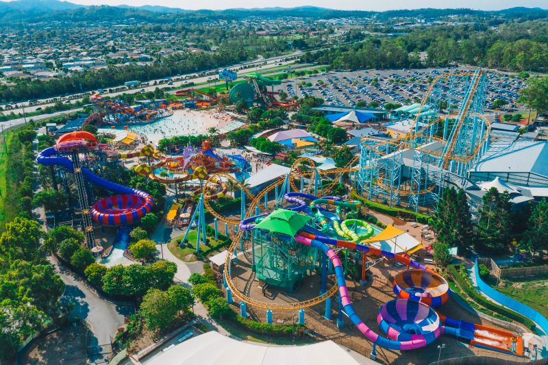 Aerial view of Dreamworld and WhiteWater World, with rollercoasters, water slides and the wave pool spread across the park.
